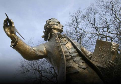 Statue of Thomas Paine holding the book Rights of Man